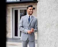 Image of Grey suit with dark grey bag and shoes