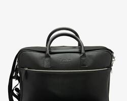 Image of Black leather bag with black leather shoes