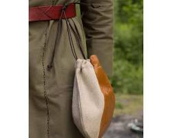 Image of merchant carrying a leather pouch