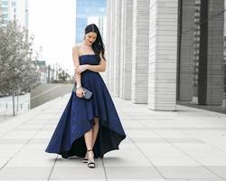 Image of Long evening dress with small clutch bag and high heels