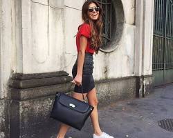 Image of Black shirt with red skirt, white bag, and black shoes